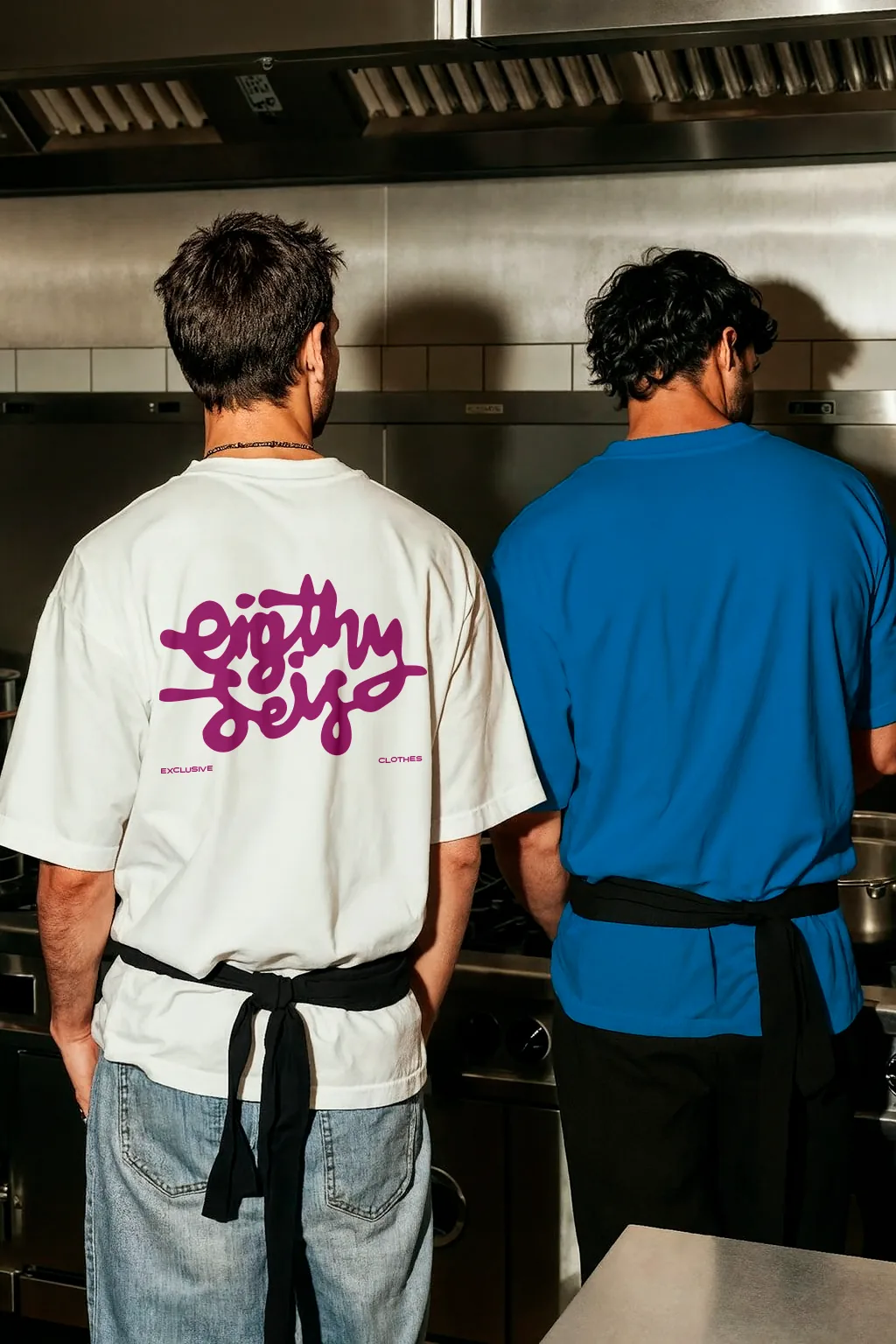The Eighty Seis tee worn on a working kitchen line, logotype printed across the back